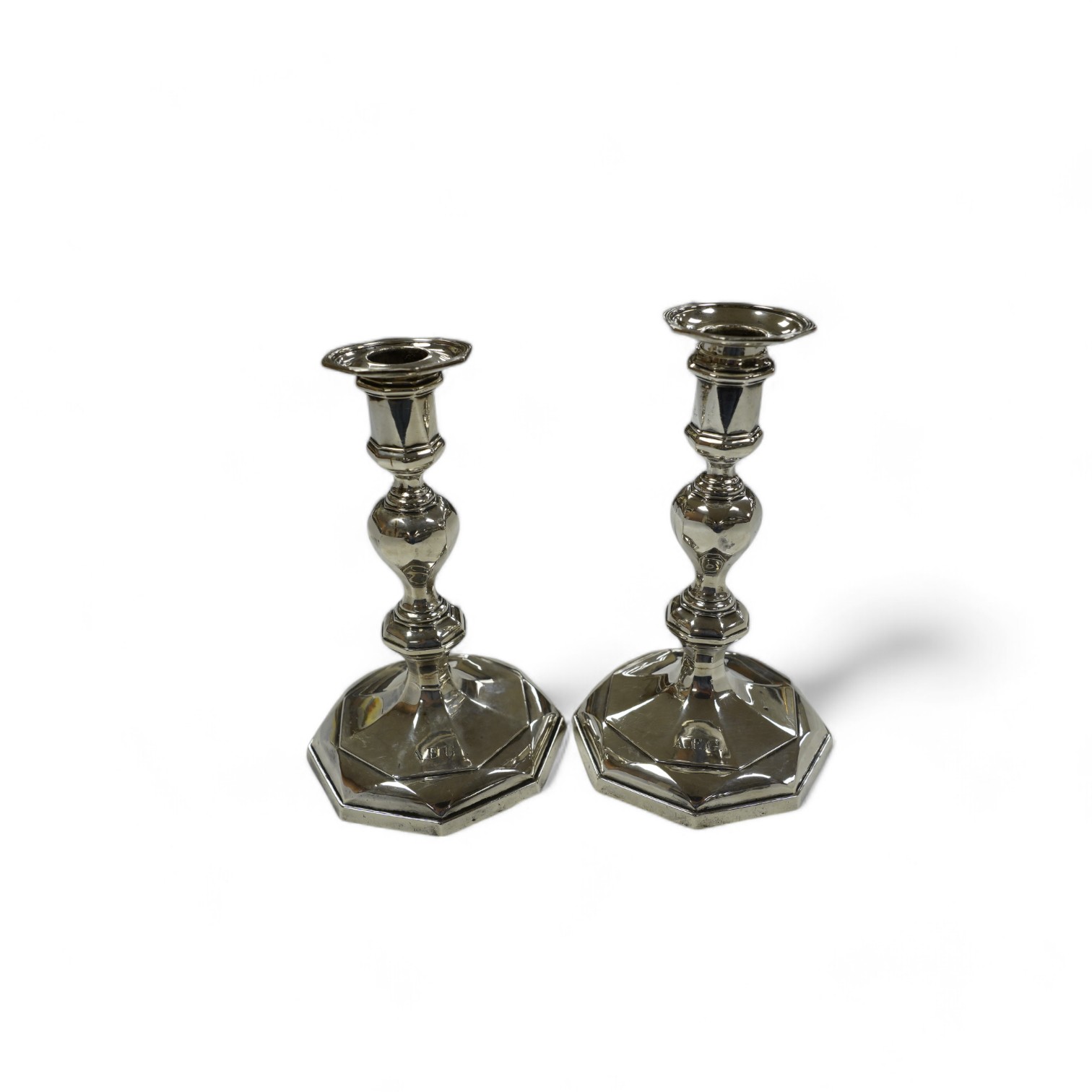 A pair of George V silver candlesticks, by West & Son, Sheffield, 1910, 17cm, weighted. Condition - poor